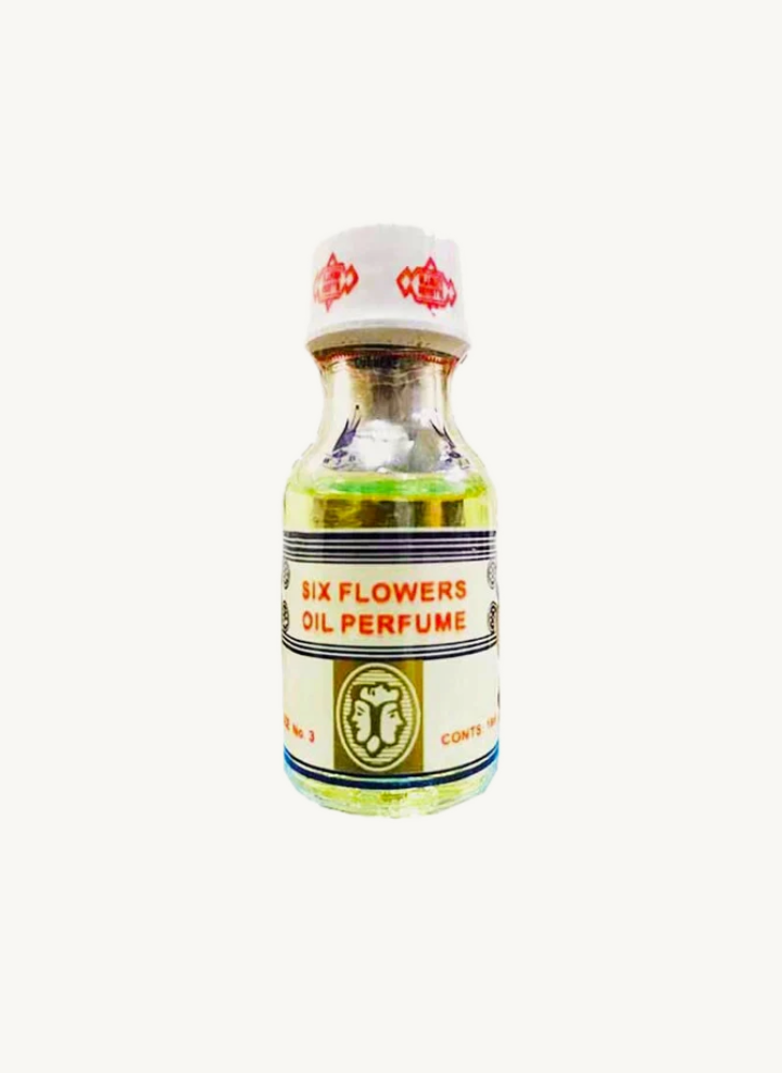Divinelight Six Flowers perfume oil in small clear glass bottle with white cap and floral label